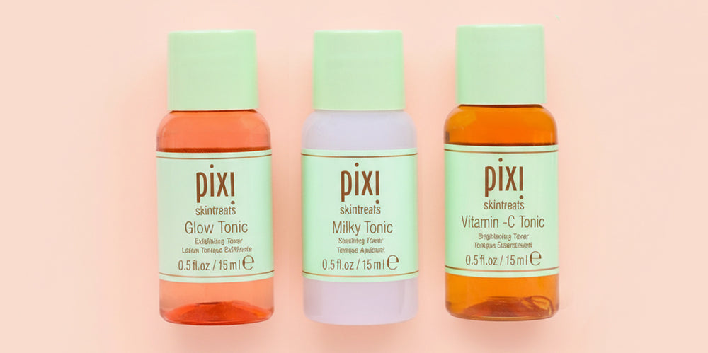 Mini Glow Tonic, Milky Tonic and Vitamin-C Tonic on orange background