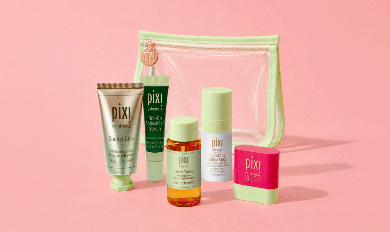 GradualGlow, Roll-On AntioxifEYE Serum, Glow Tonic, Hydrating Milky Mist and On-the-Glow Blush in petite sizes shown on a pink background with Clear Travel Bag - View 1