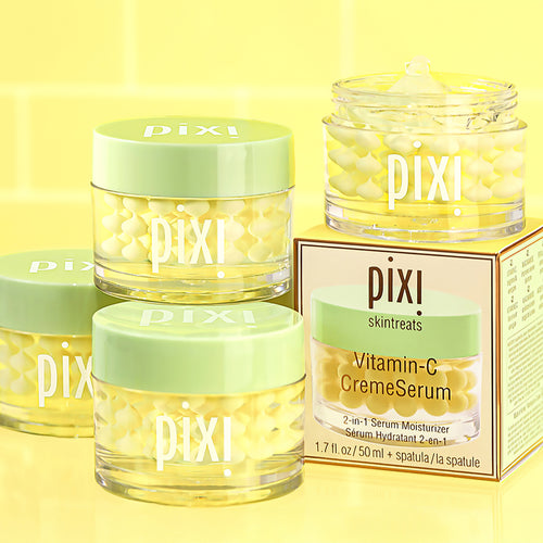 Multiple bottles of Vitamin-C CremeSerum shown on a yellow background