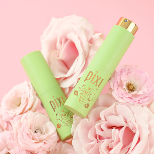 PixiPerfume PixiRose two bottles with pink background and roses 