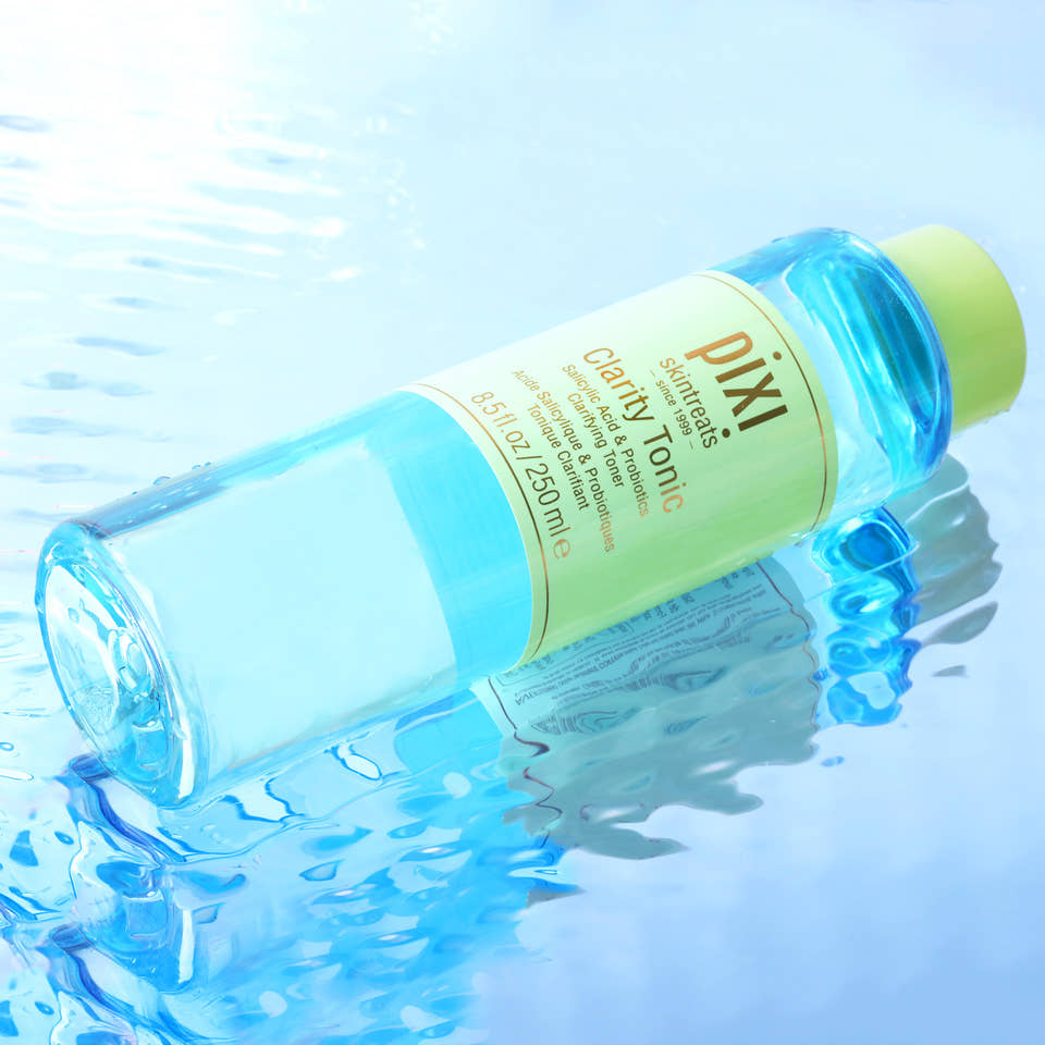 Pixi Clarity Tonic bottle on a blue water background view 2