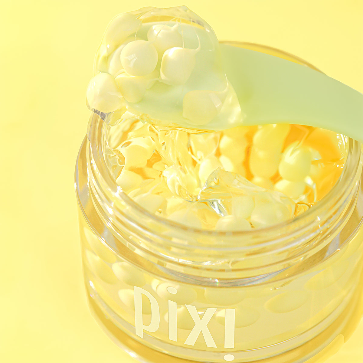 Jar of Vitamin-C CremeSerum with a spoonful taken out to