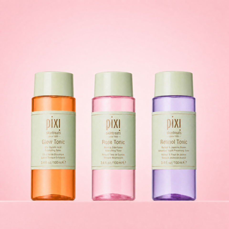 Essential Tonic Trio shown on a pink background featuring Glow Tonic, Rose Tonic and Retinol Tonic view 1